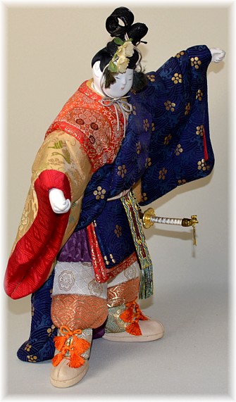 japanese traditional kimekomi doll of a dancing nobleman