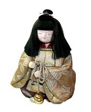 japanese traditional doll of boy with bell