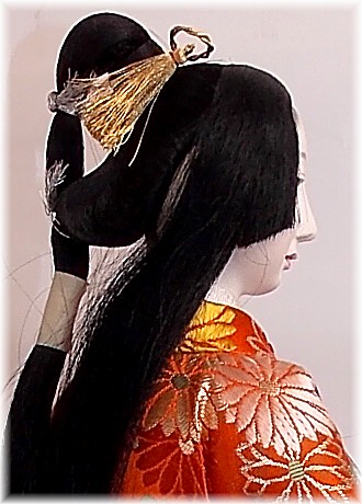 japanese doll with intricate hair style