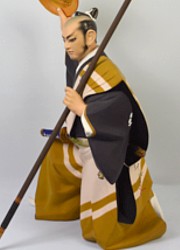 Japanese hakata doll of a samurai warrior with spear and sake bowl
